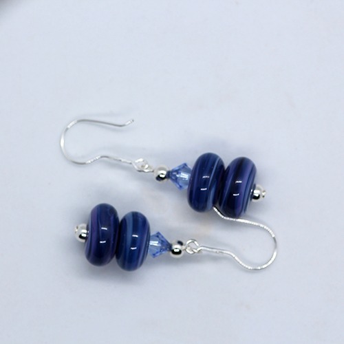 Deep blue toned Handmade artisan glass swirl double bead earrings with light blue crystal bead accent and star hook