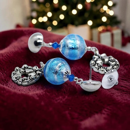 Emily Poppellwell Jewellery handmade blue artisan glass stud earrings with silver Christmas wreath drops and crystals.