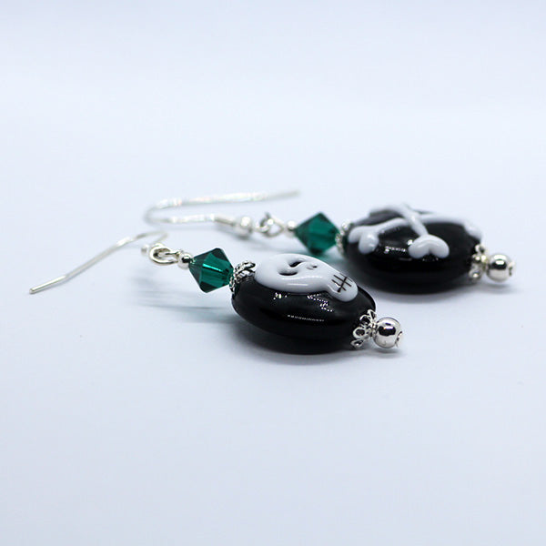 Mismatched Halloween black & white skull and cross bones, green crystals Artisan Glass earrings
